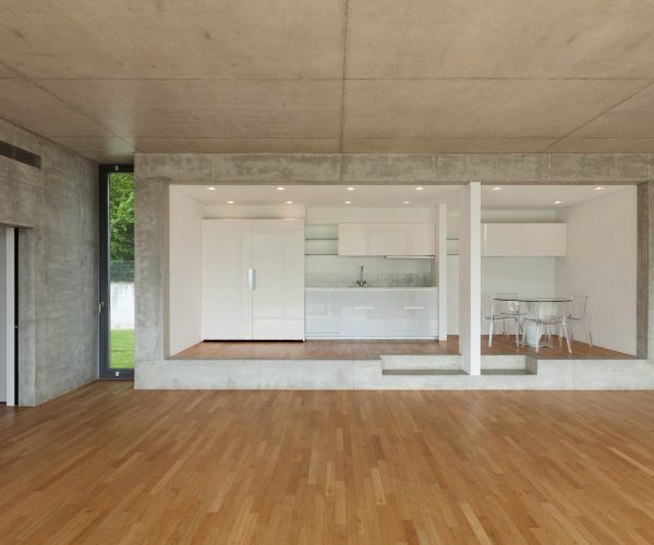 Interior, modern kitchen of concrete apartment, parquet floor